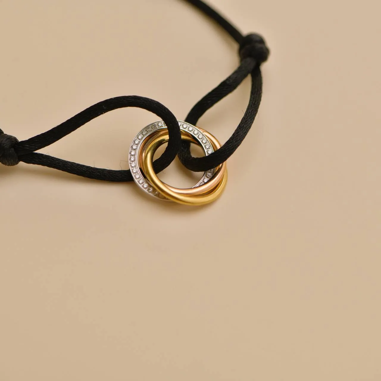 Cartier Trinity Diamond 18K Yellow White and Rose Gold Black Cord Bracelet
