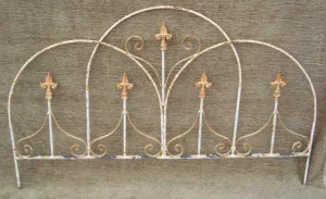 Iron Dome Arch Fence with Fleur De Lis Finials decorative plants  