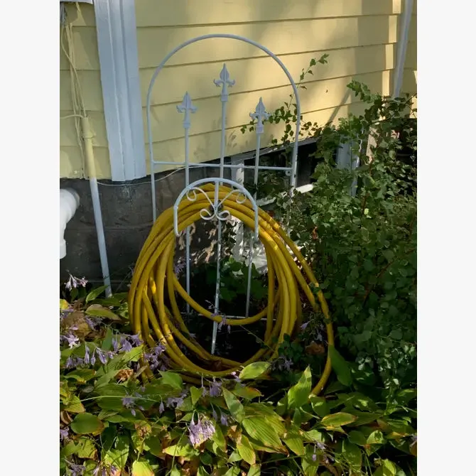 Iron Hose Wheel with 3 Finials & Stakes into the Ground