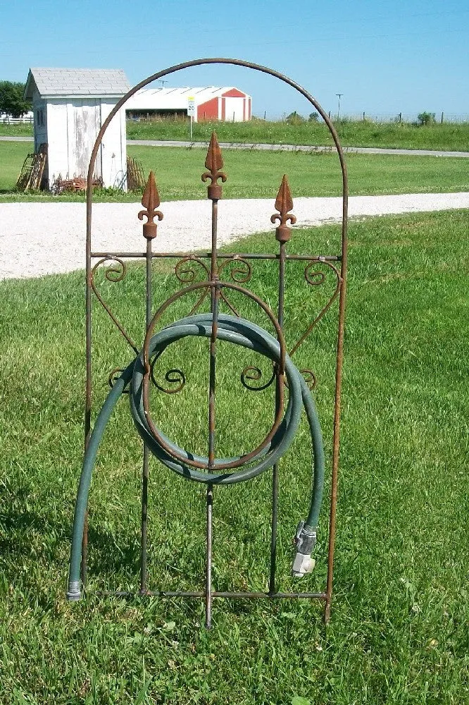 Iron Hose Wheel with 3 Finials & Stakes into the Ground decorative plants  