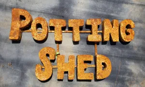 Metal Potting Shed Sign decorative plants  