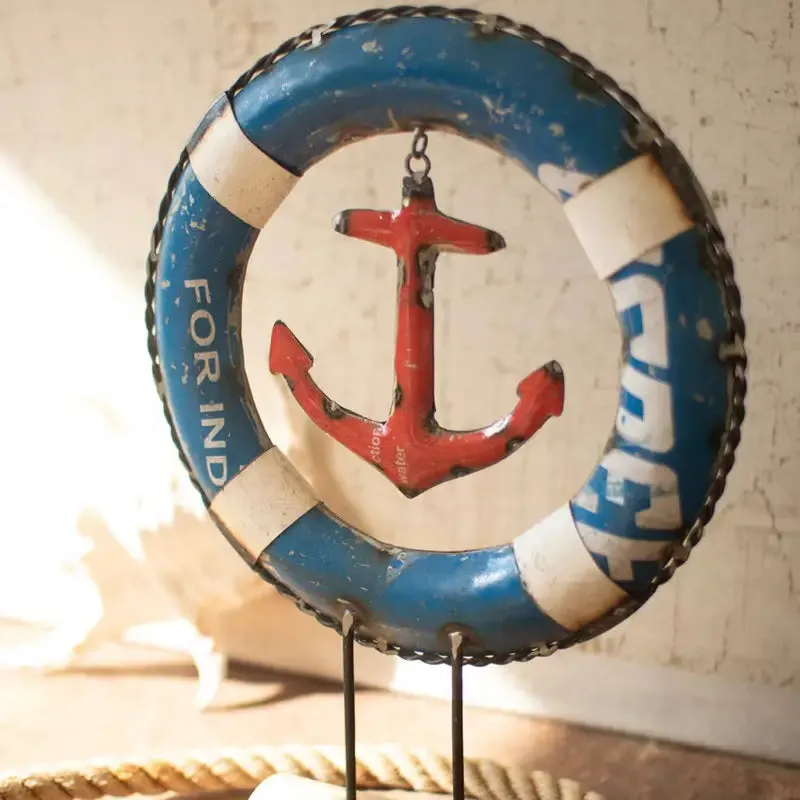Recycled Iron Life Preserver On Stand dried flowers  