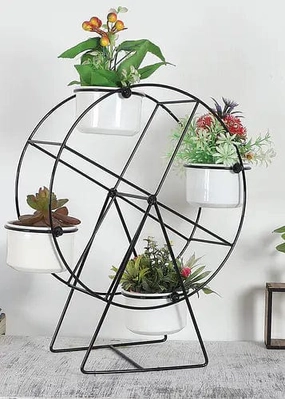 Revolving Wheel Planter Stand (Black & White) hanging green plant  