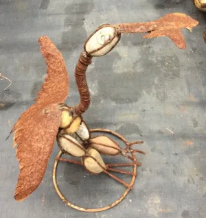 ROCK HEREIN W. FISH IN MOUTH dried flower branch  
