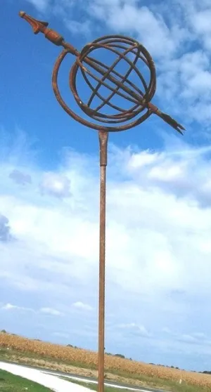 Sundial with Rod dried flower branch  