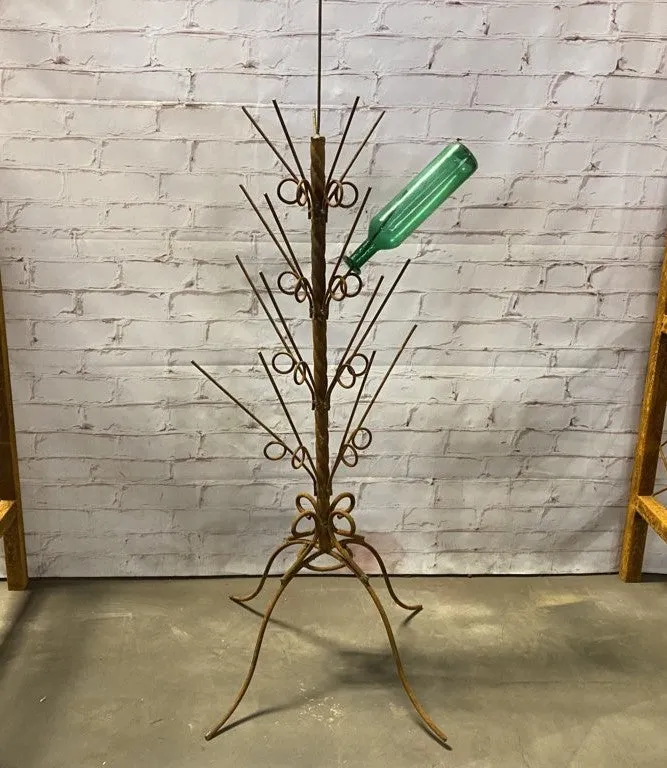 Wrought Iron Twisted Bottle Tree with a four-legged stand