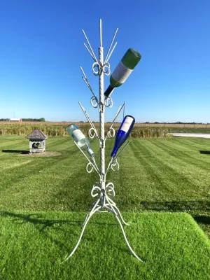 Wrought Iron Twisted Bottle Tree with a four-legged stand dried flower branch  